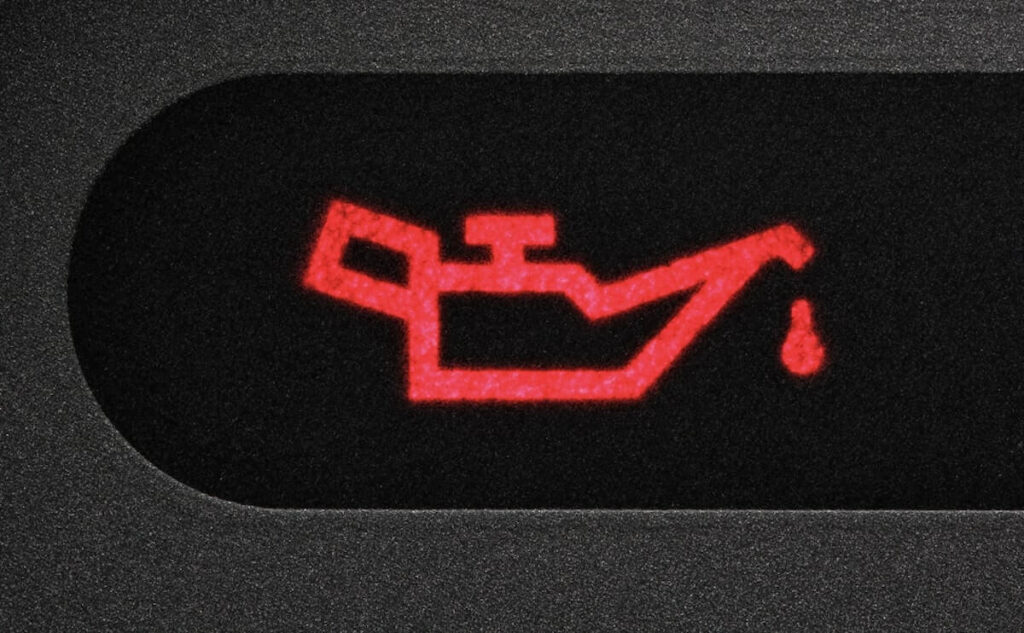warning red circle light on dashboard - oil temperature